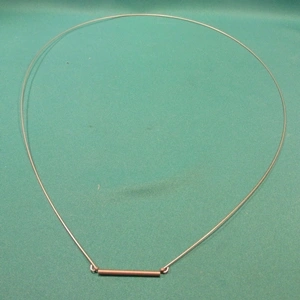 Rugó, üstszájgumi leszorító első (eredeti) INDESIT mosógép 